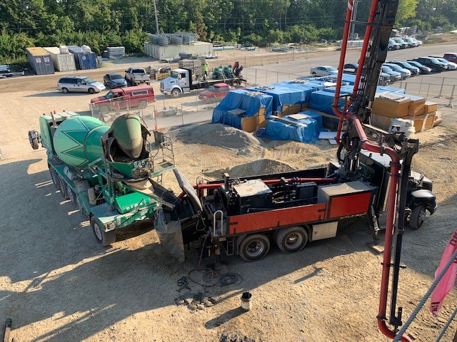 Concrete is being pumped into the main spine area on the north side of the building